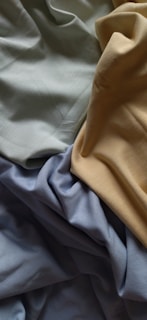a close up of a bed with sheets and sheets