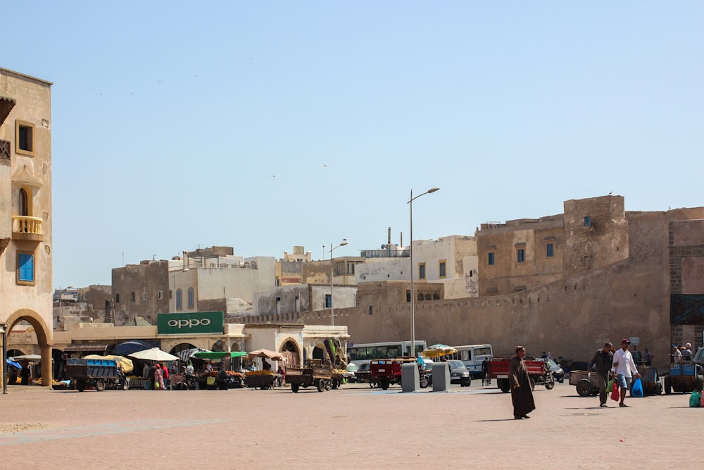 a group of people walking around a city