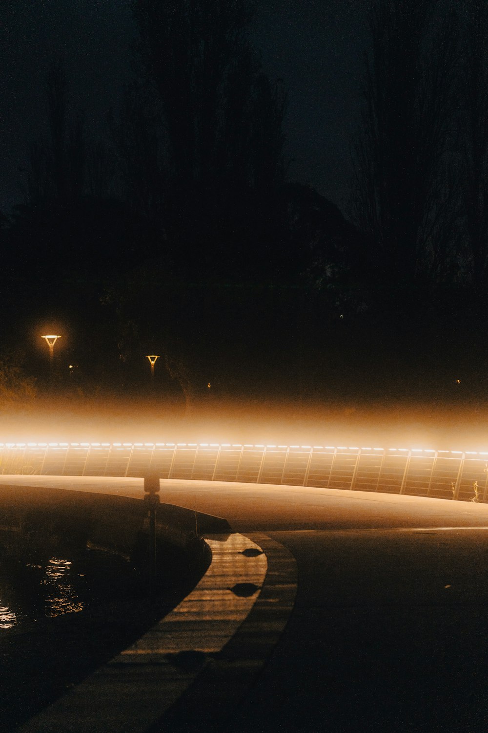 a long exposure photo of a street at night