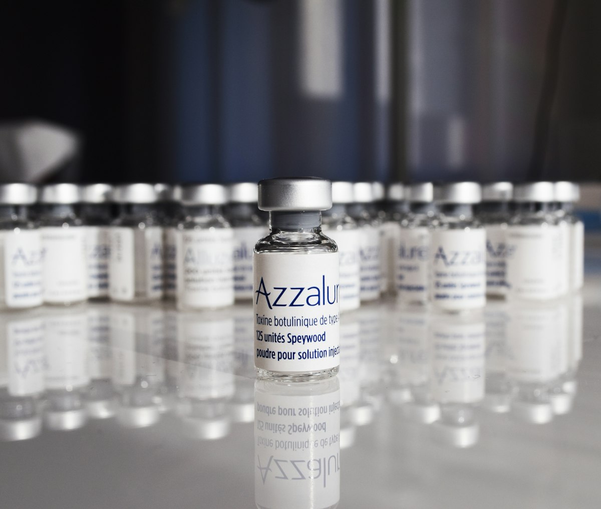 A row of small glass vials lined up on a table
