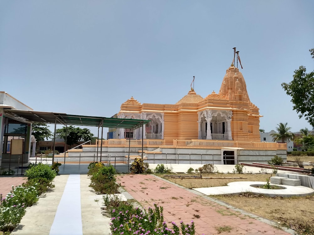 a large wooden building with a cross on top of it