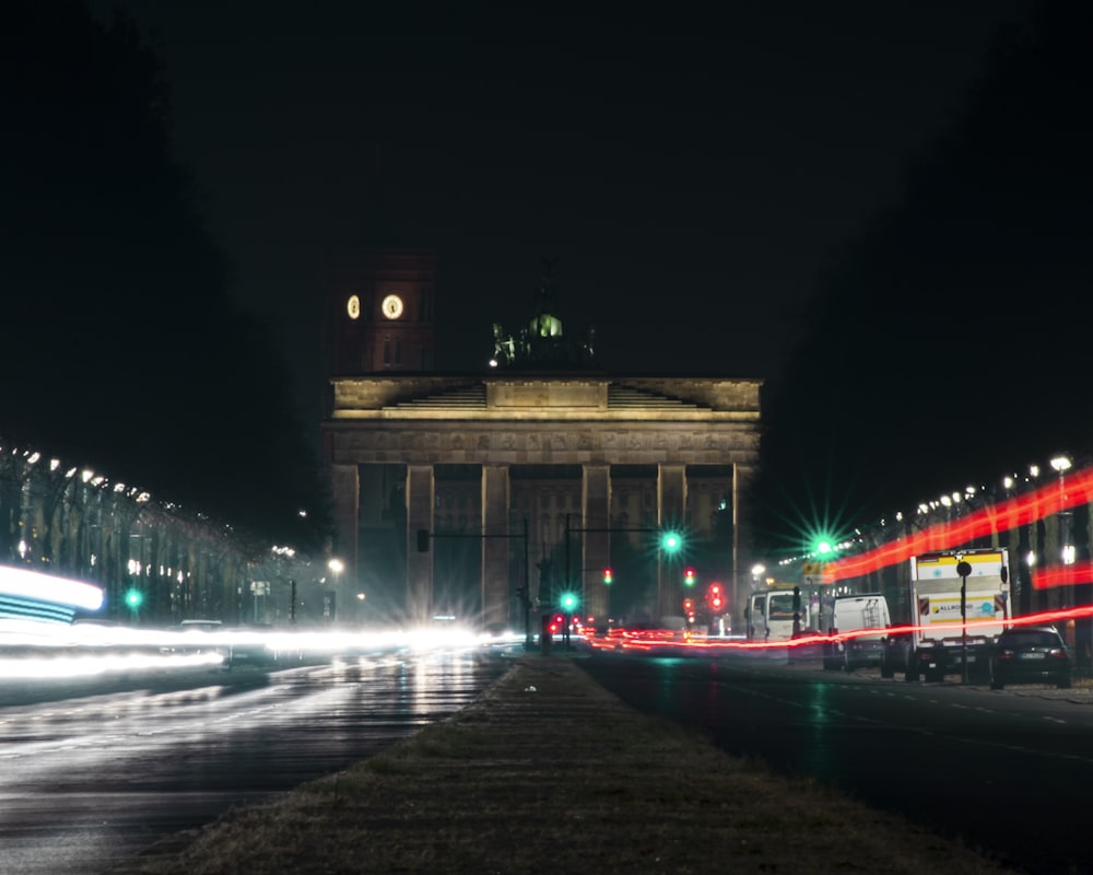 a city street filled with traffic at night