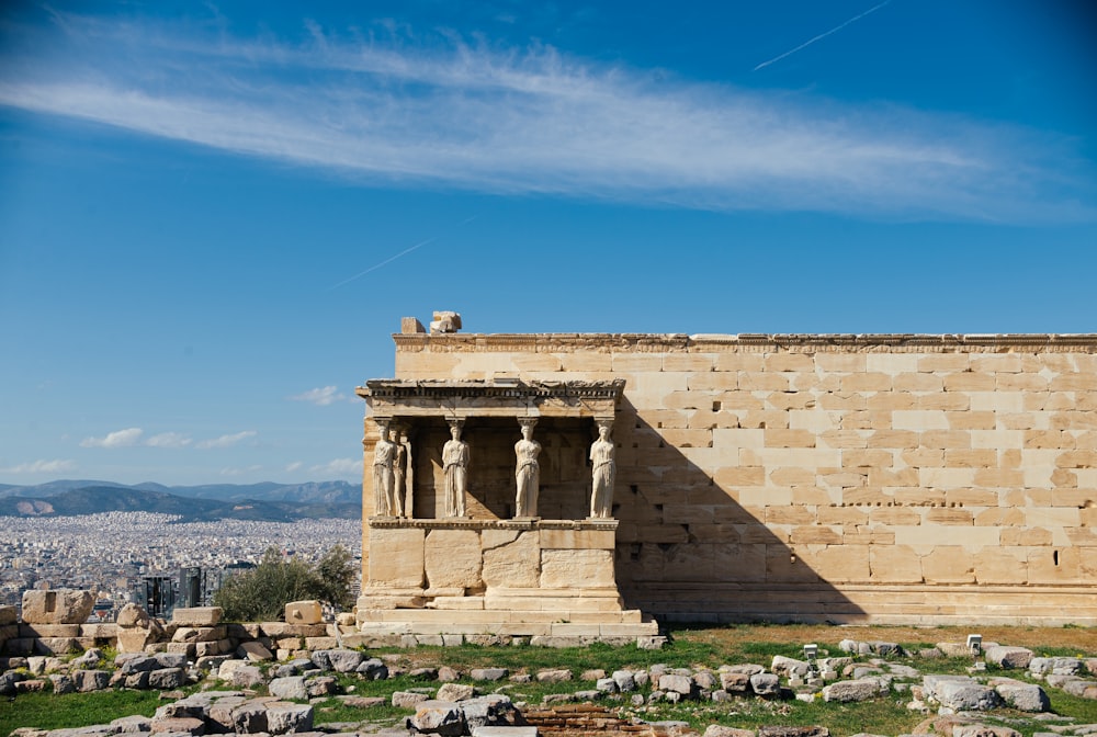 a large stone structure with a sky in the background