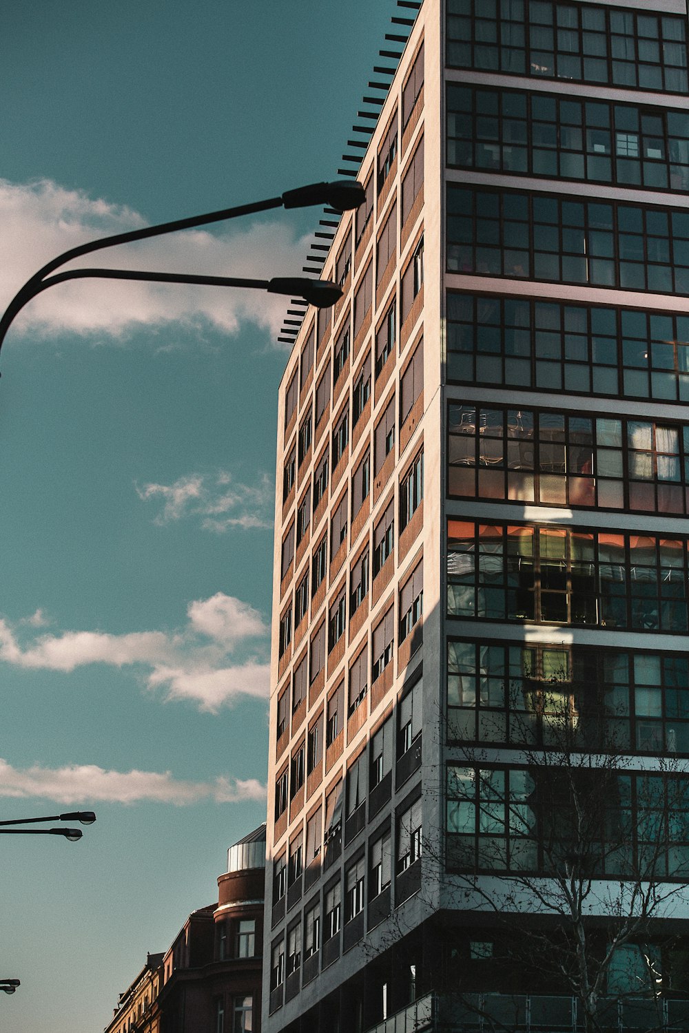 a tall building sitting next to a traffic light