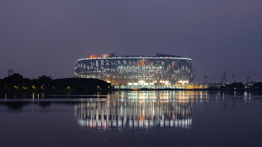 a large building sitting on top of a lake