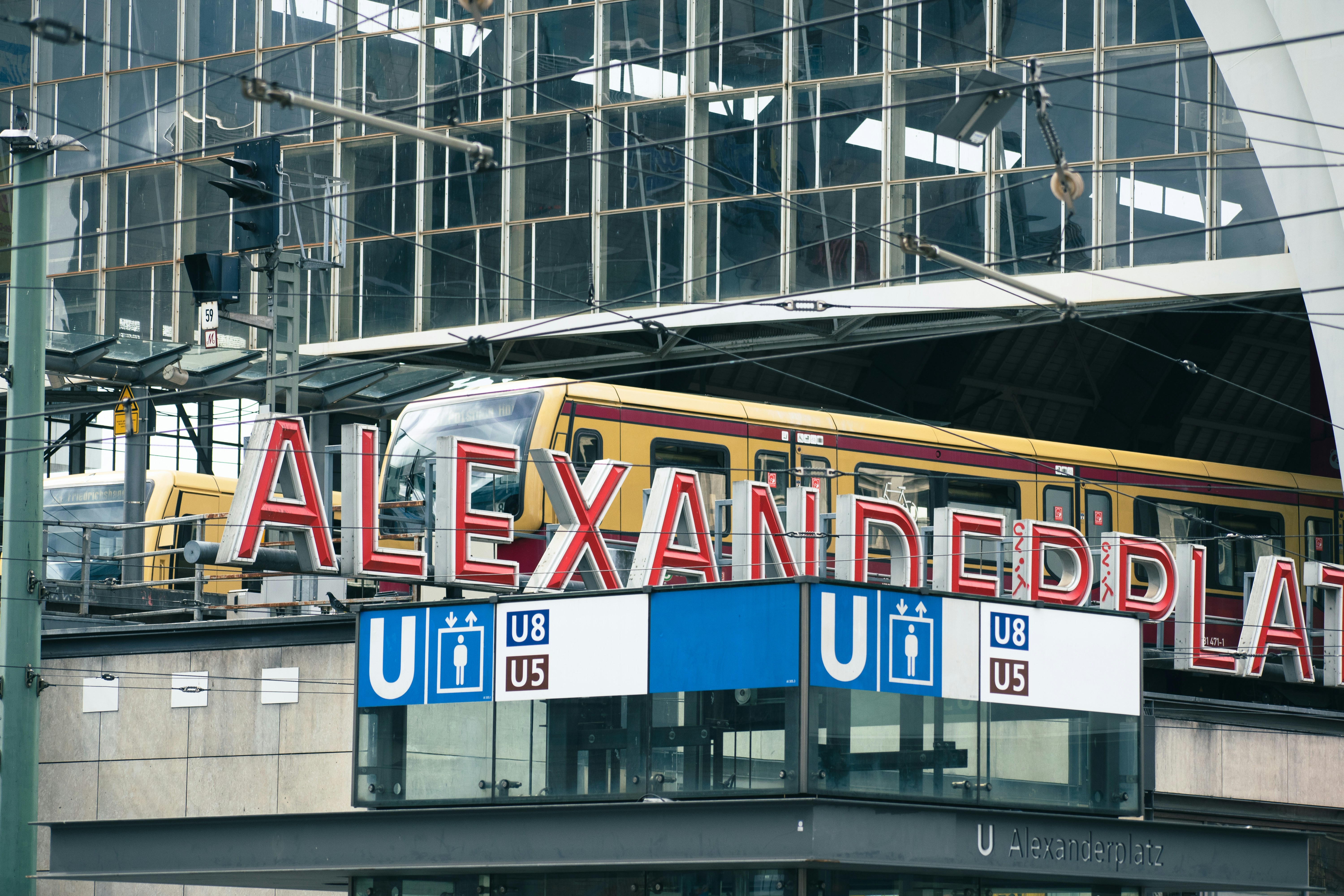 a train on a train track near a building