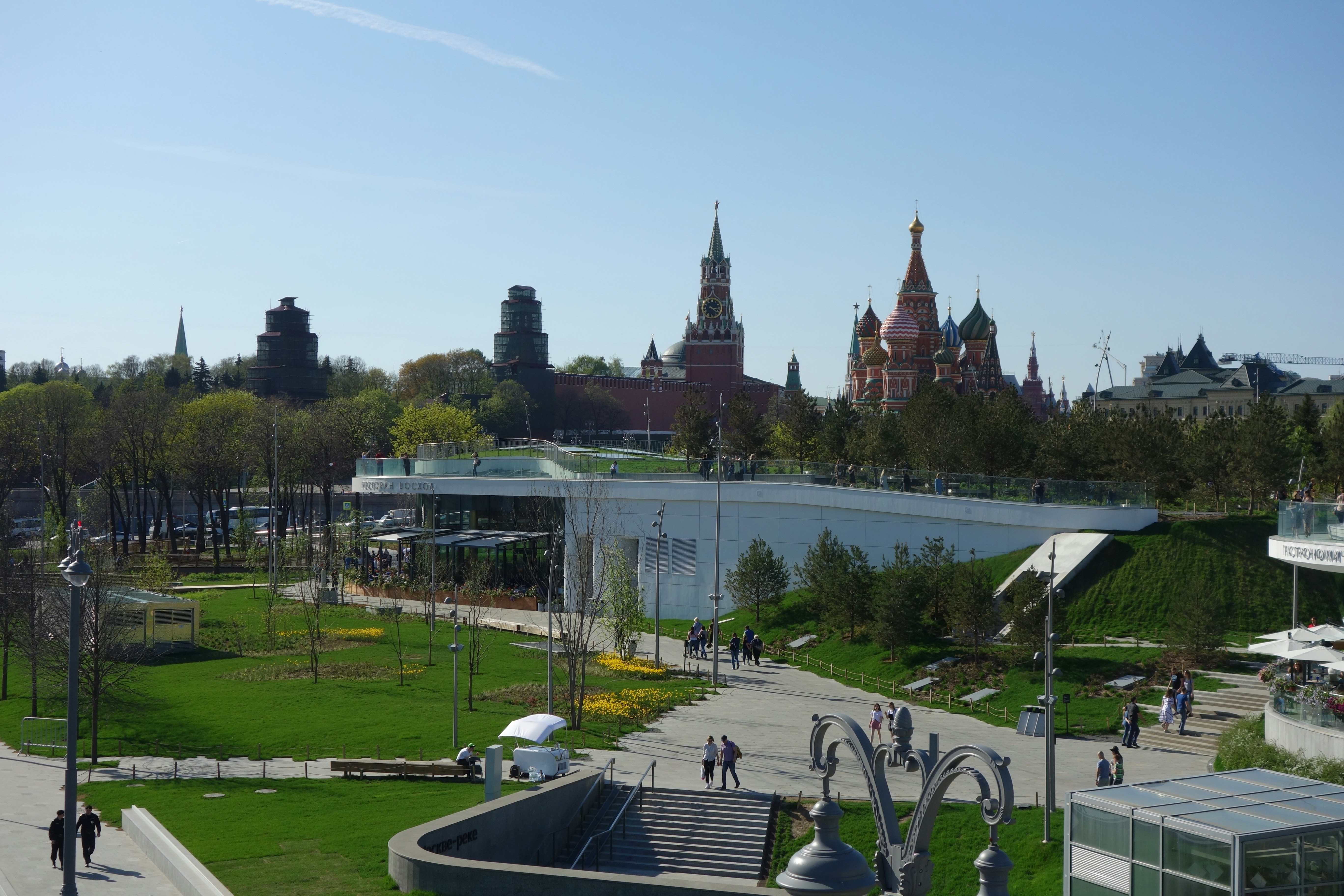 a view of a park with people walking around