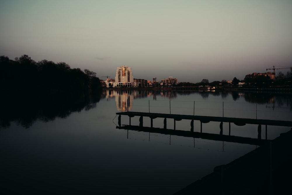 a body of water with a bridge in the middle of it