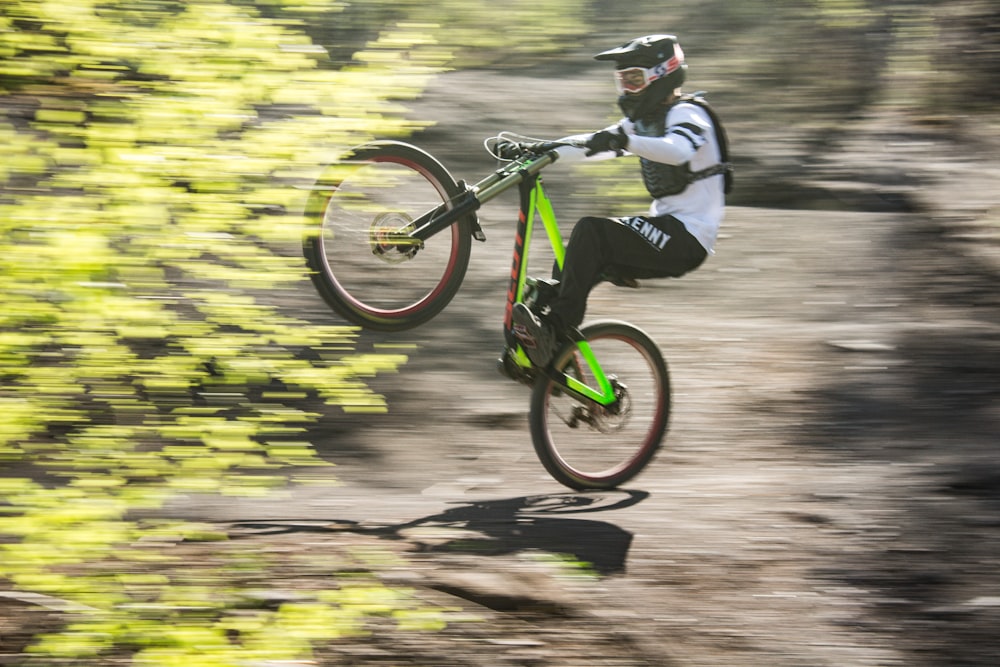 a man riding a bike up the side of a mountain