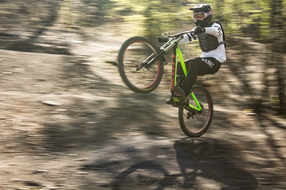 a person on a bike doing a trick in the air