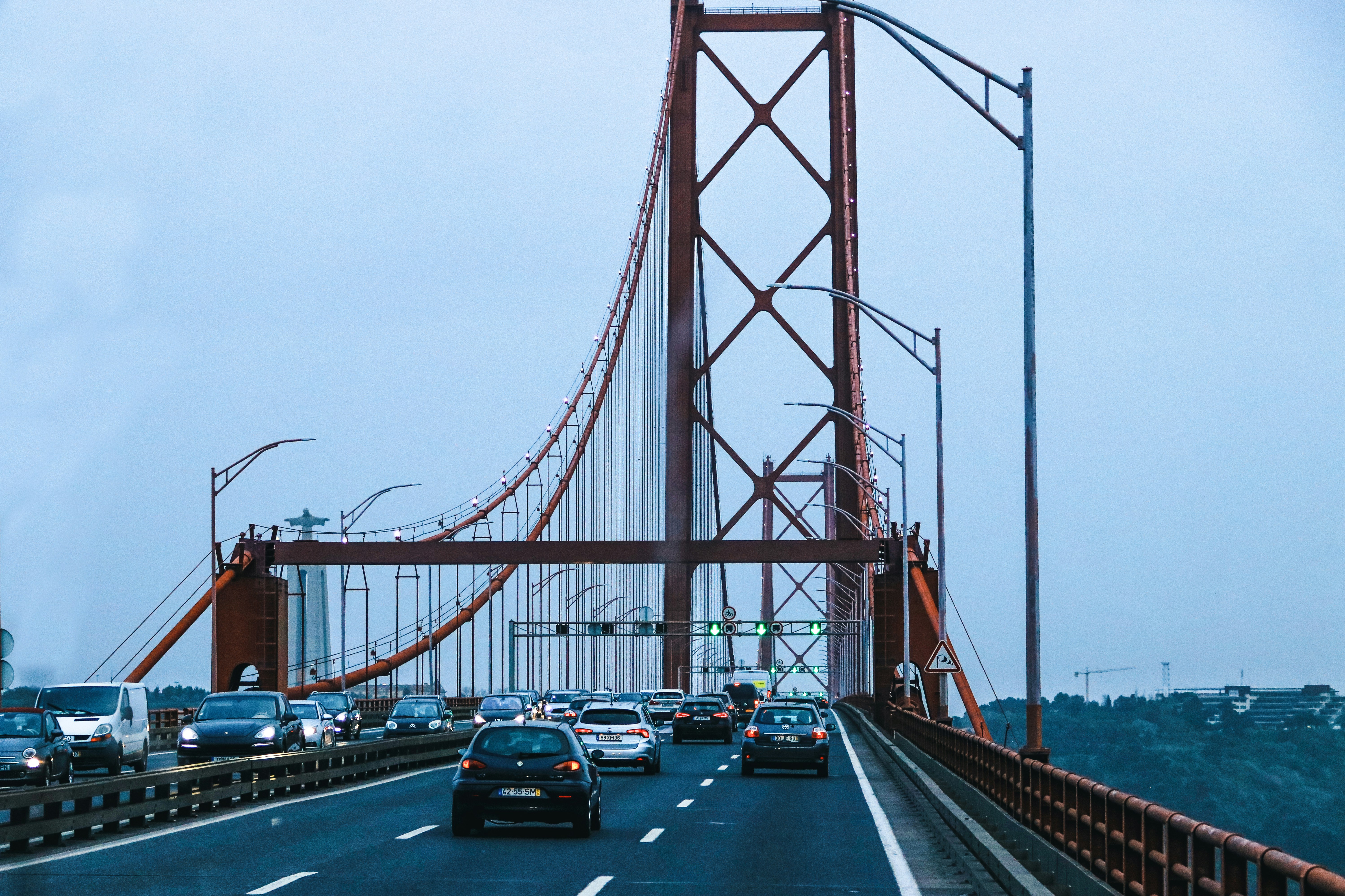 a view of a bridge with cars driving on it