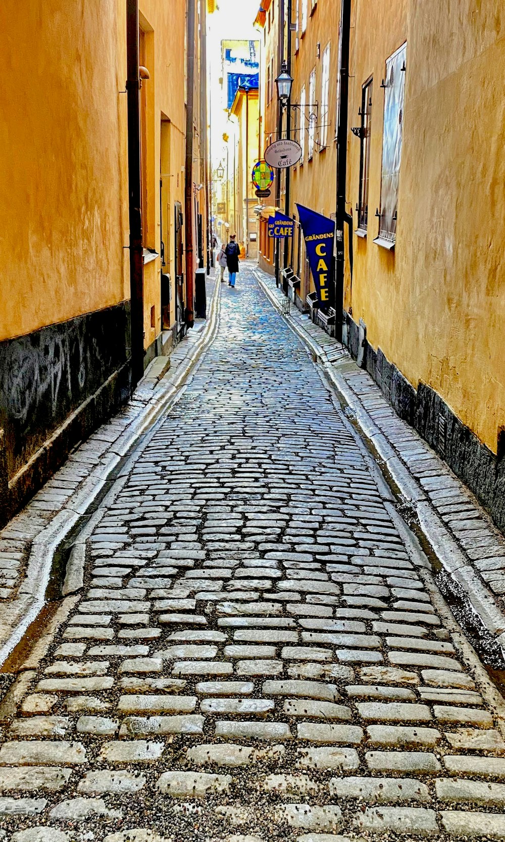 a cobblestone street in a european city