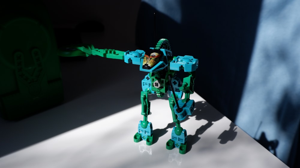 a lego robot is standing on a table