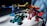 Three colorful toy robots are positioned on a white surface. The robots are constructed with interlocking plastic pieces in blue, yellow, and red colors. Sunlight casts shadows, adding depth to the scene, and a blue curtain is visible in the background.