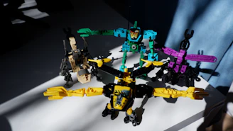 A joyful group of young children interacting with colorful robot toys in a bright classroom.