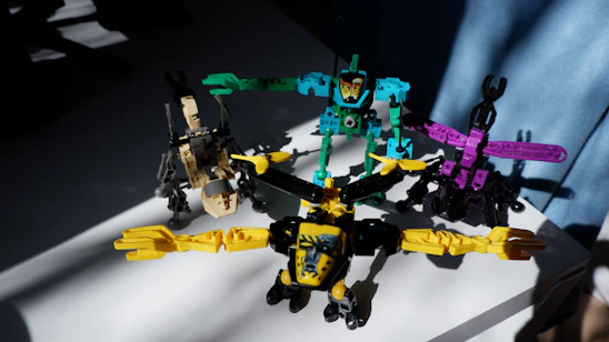 A joyful group of young children interacting with colorful robot toys in a bright classroom.