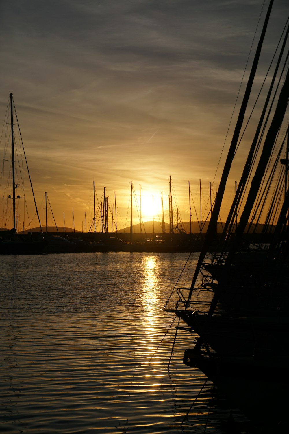 the sun is setting over a body of water