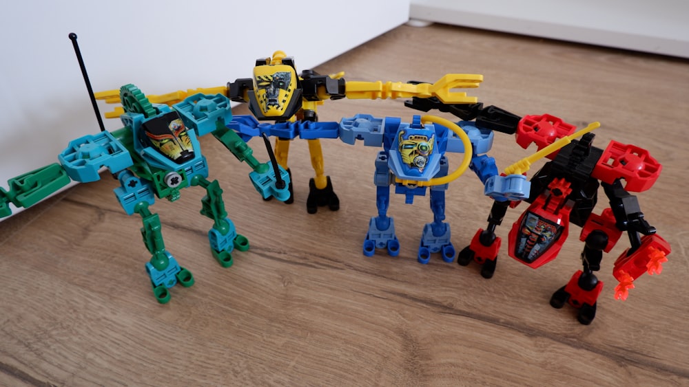 a group of toys sitting on top of a wooden floor