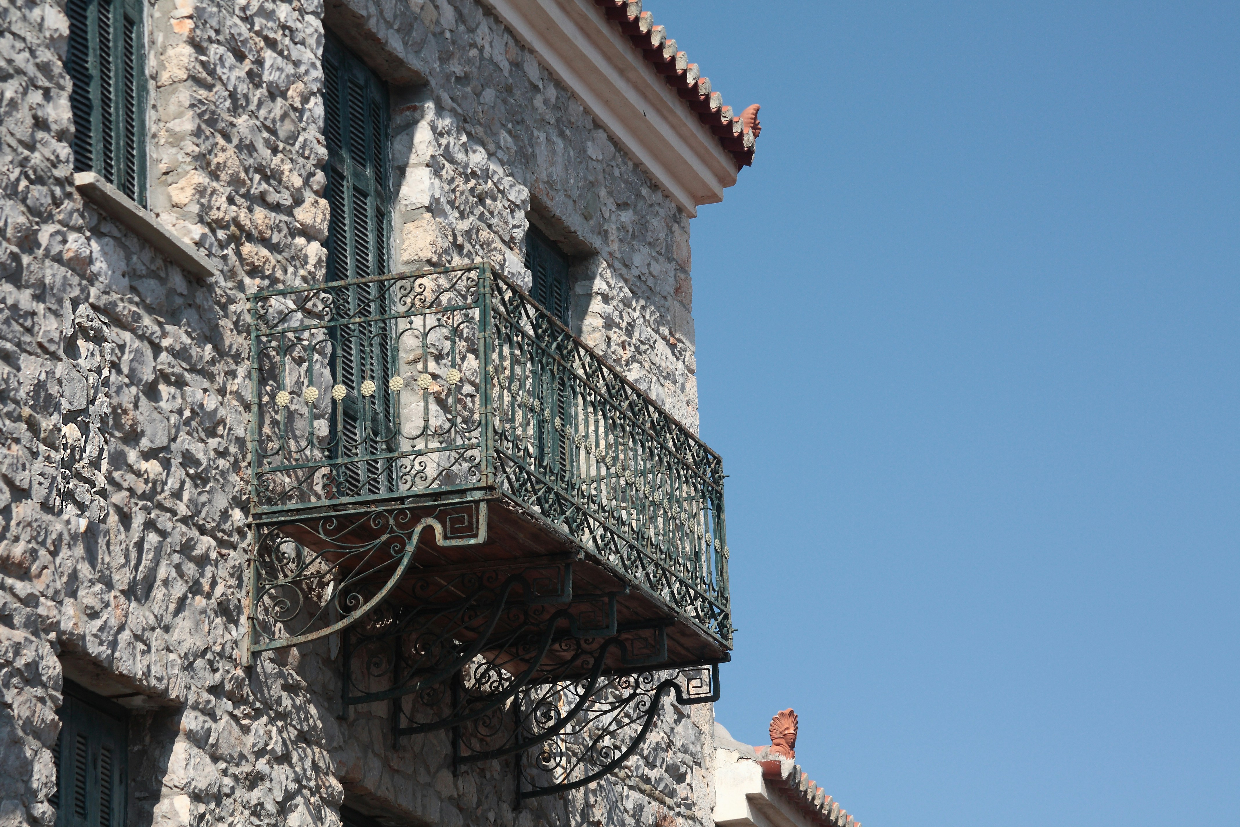 a building with a balcony and balcony railing