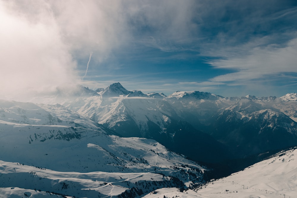 a view of a mountain range from a ski slope