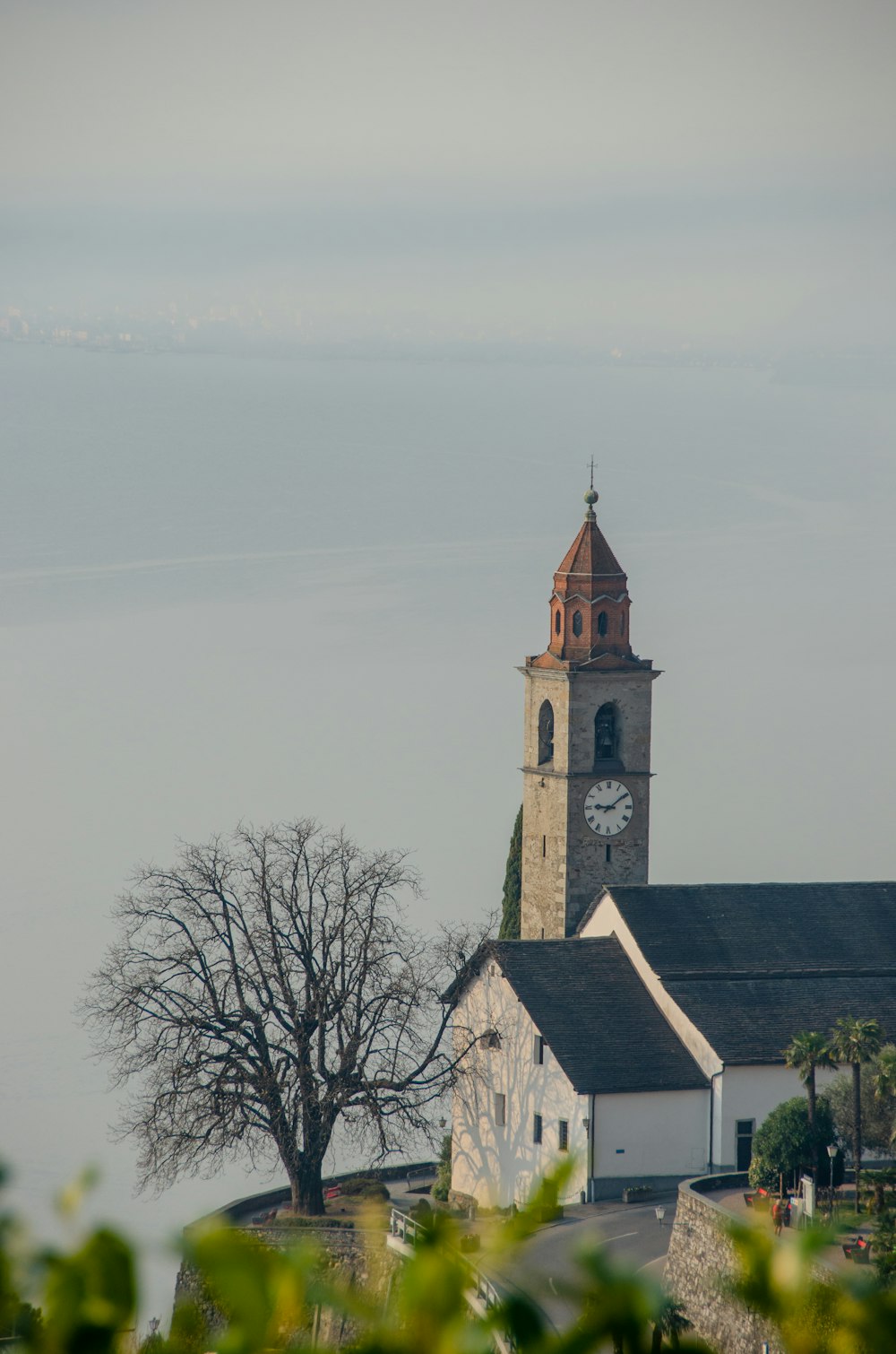 a church with a clock tower in the background