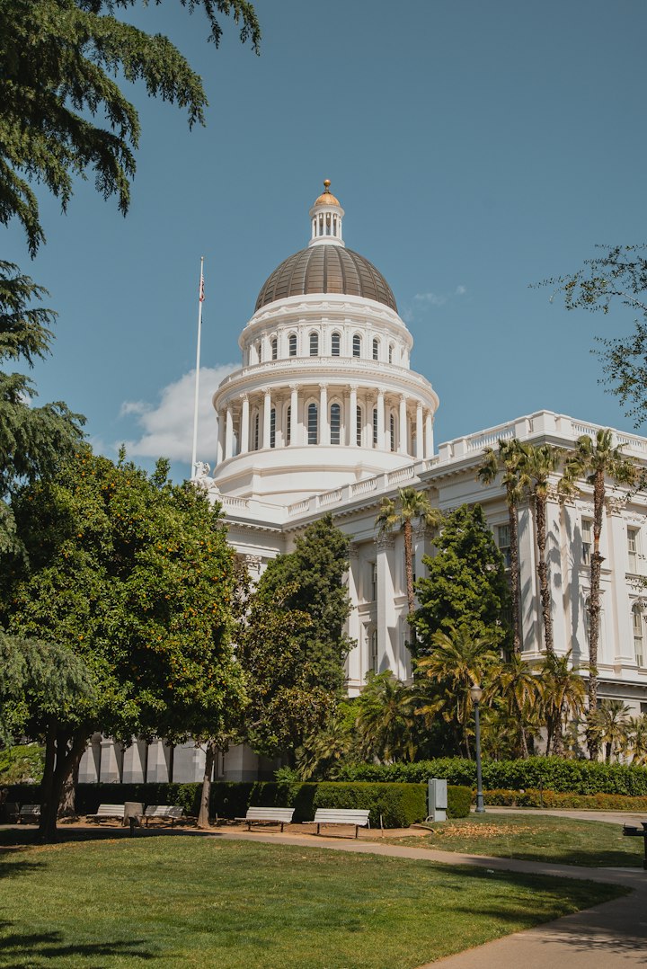 California State Capitol with flag