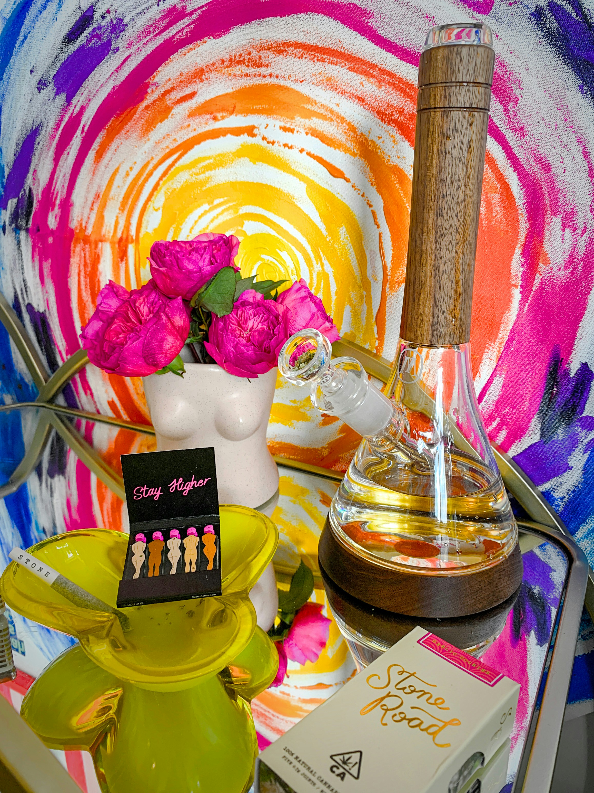 a table topped with a vase filled with flowers