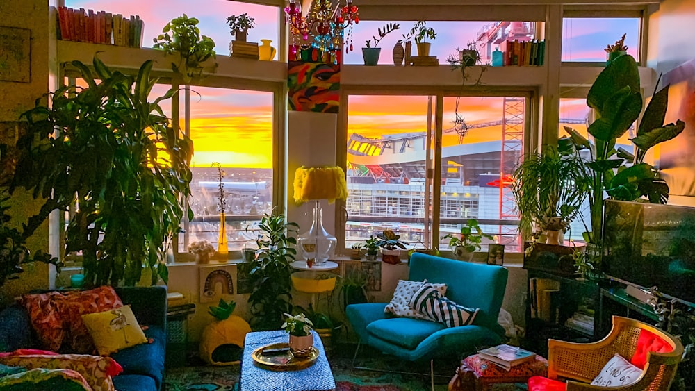 a living room filled with furniture and lots of windows