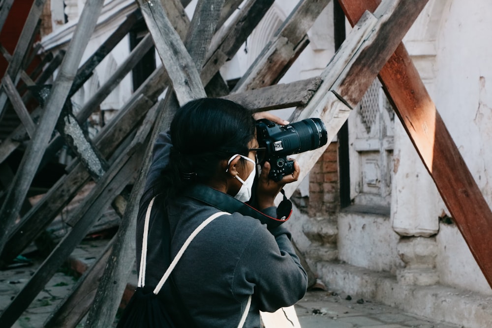 a woman taking a picture with a camera