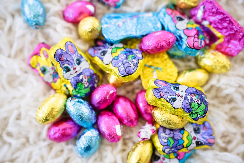 a pile of chocolate candies sitting on top of a white blanket