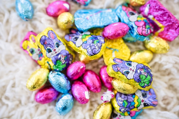 A pile of chocolate candies sitting on top of a white blanket