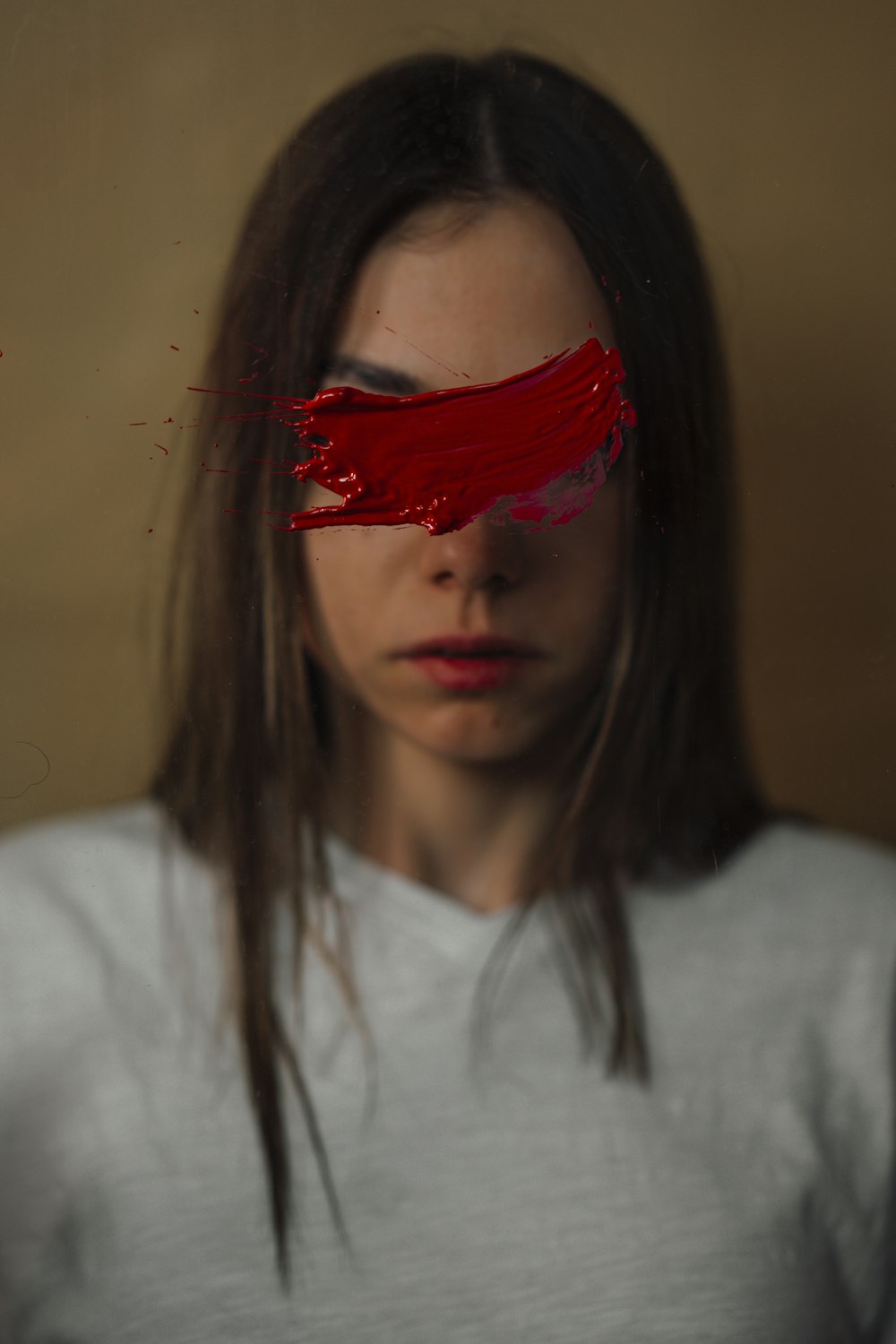 a woman with red paint on her face