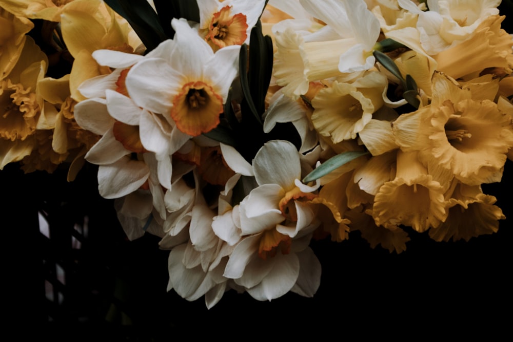 a bunch of flowers that are in a vase