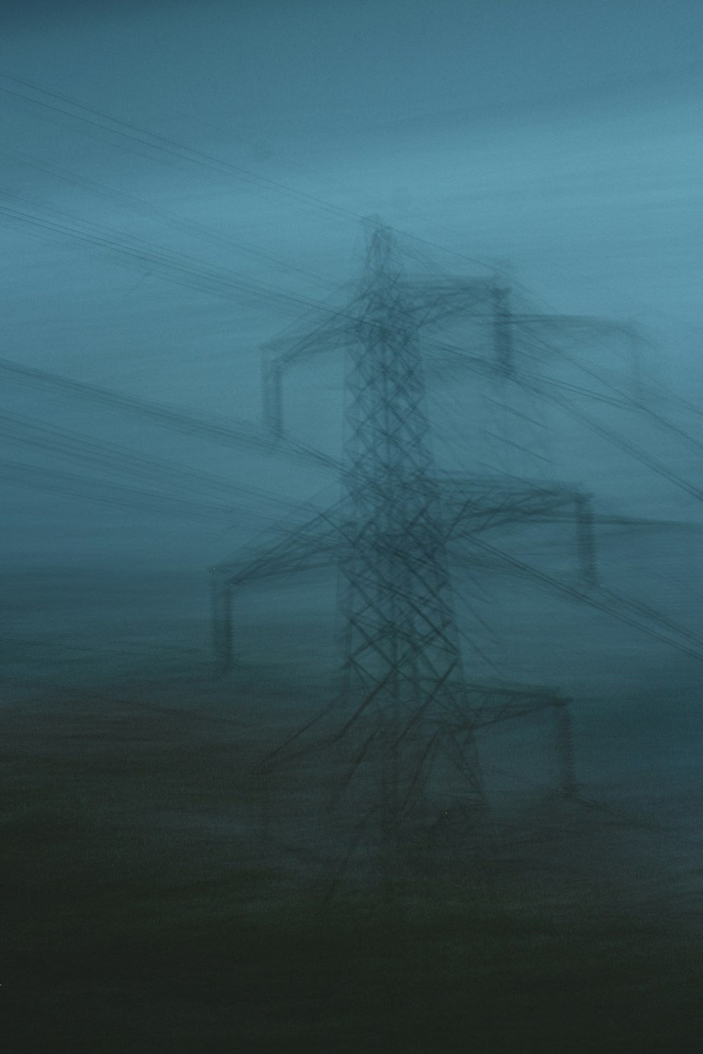 a blurry photo of a high voltage power line