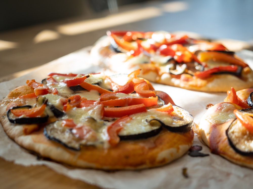 a pizza sitting on top of a wooden table