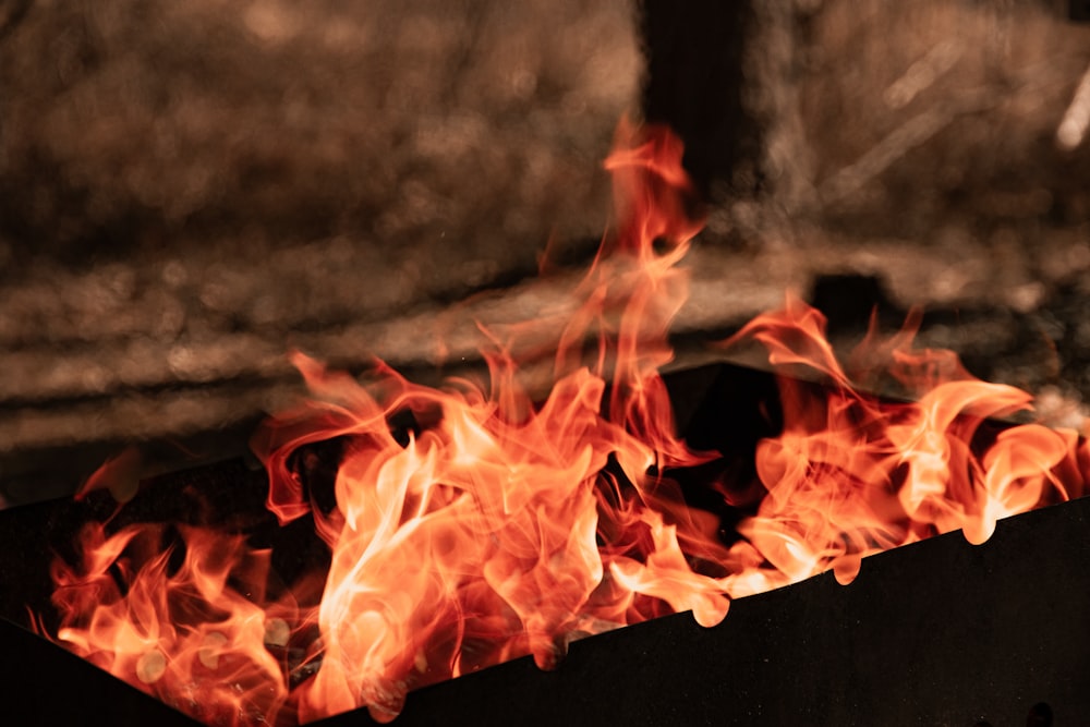 a fire pit with flames burning in it