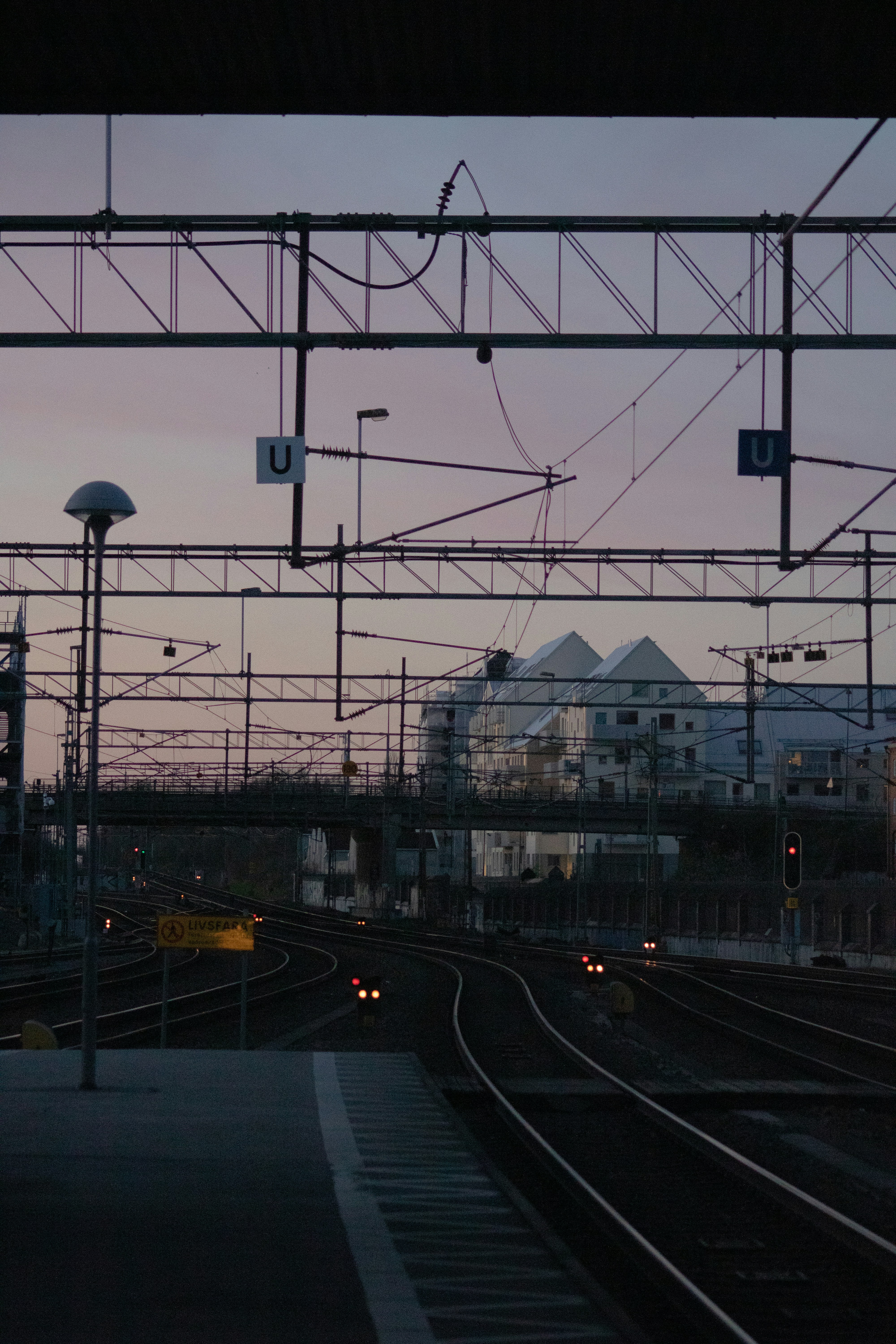 a train station with a train on the tracks
