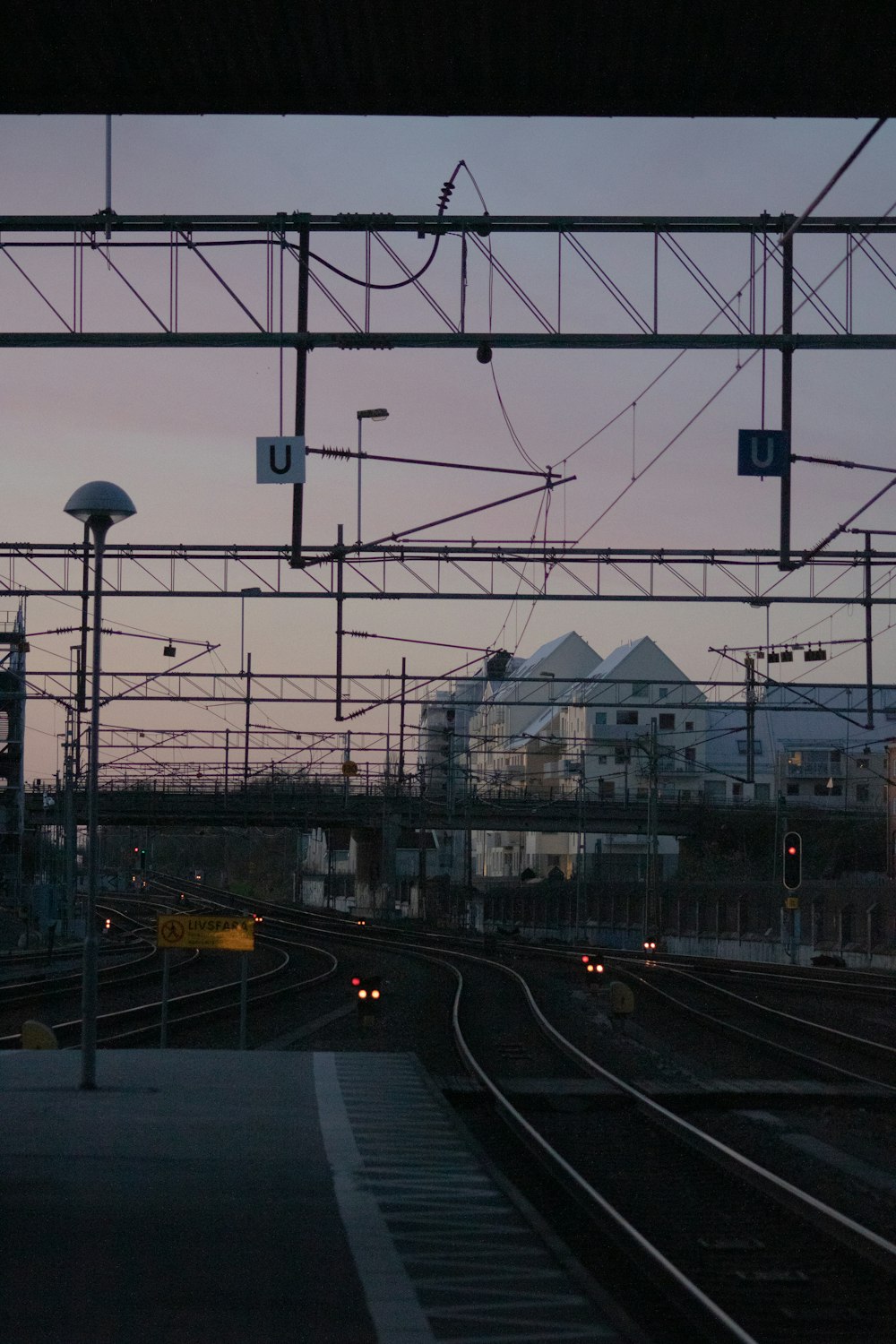 a train station with a train on the tracks