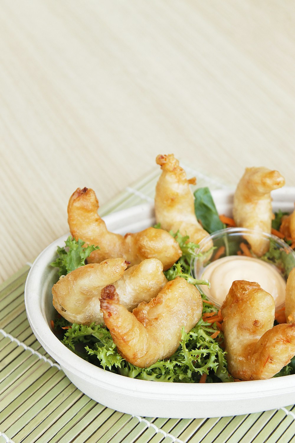 a white bowl filled with food on top of a table