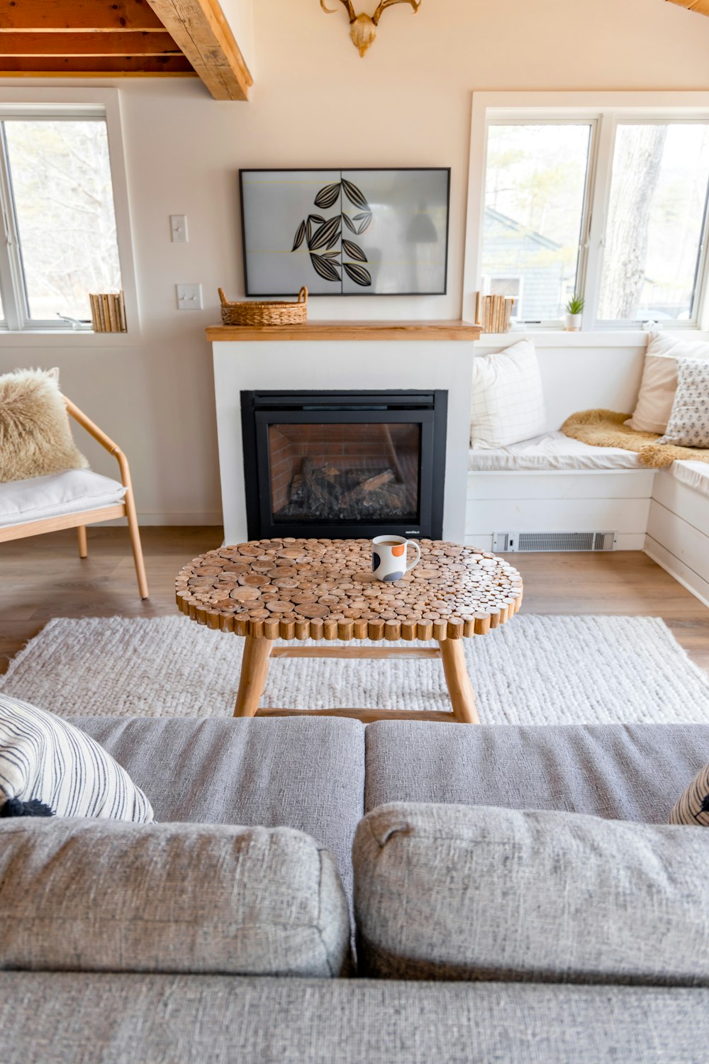 a living room filled with furniture and a fire place