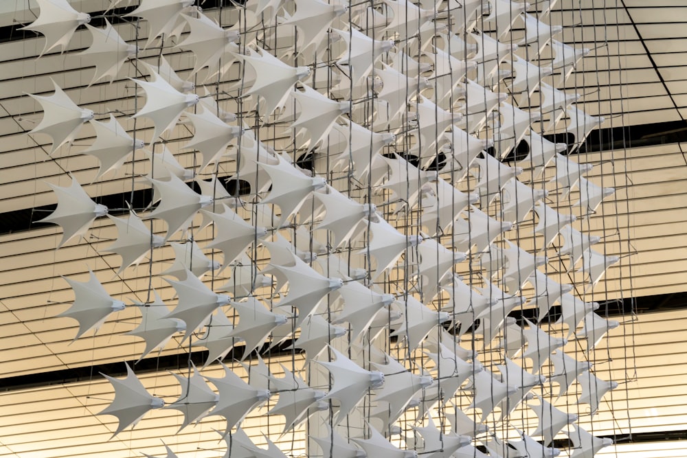 a wind chime hanging from the side of a building