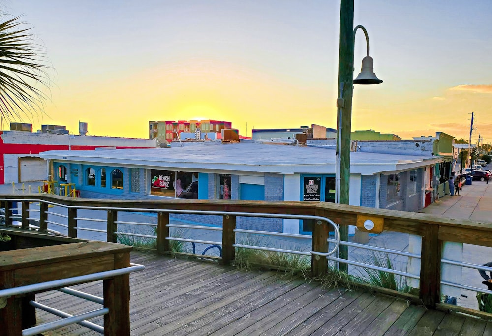 a view of a boardwalk with buildings in the background