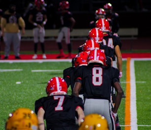 a group of football players lined up on the field