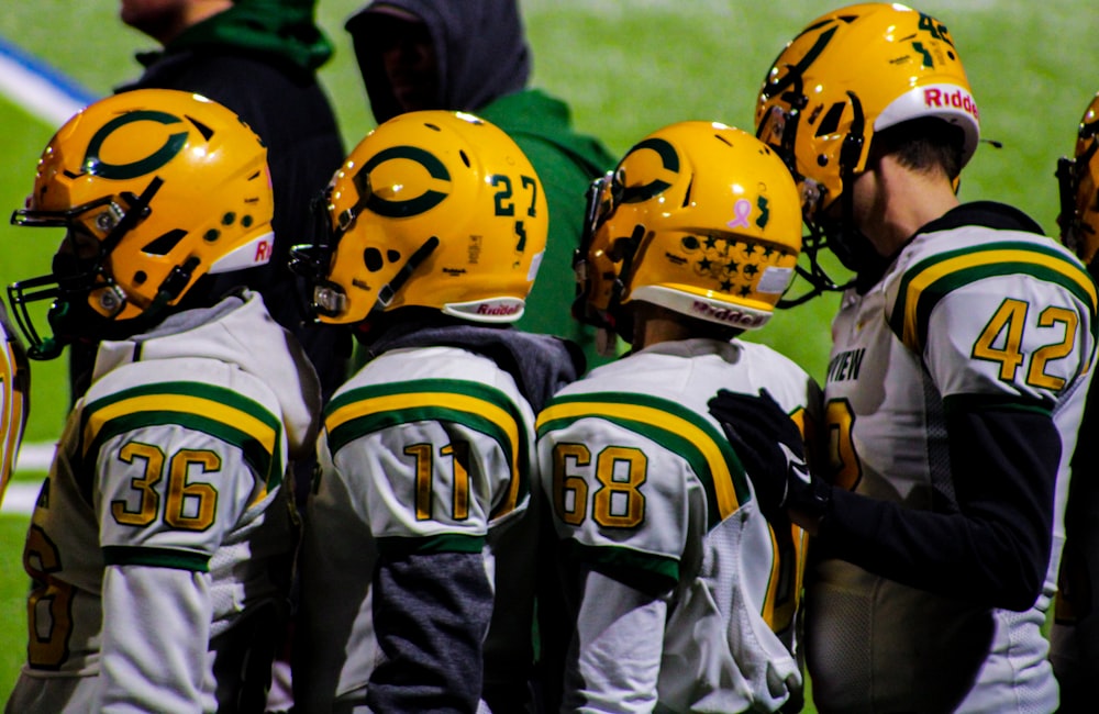 a group of football players standing next to each other