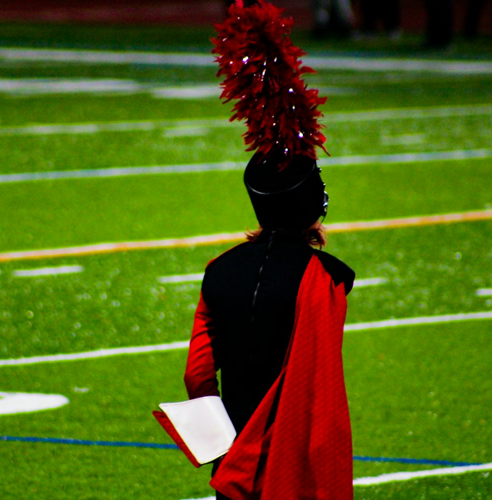 a person with a red pom pom on their head