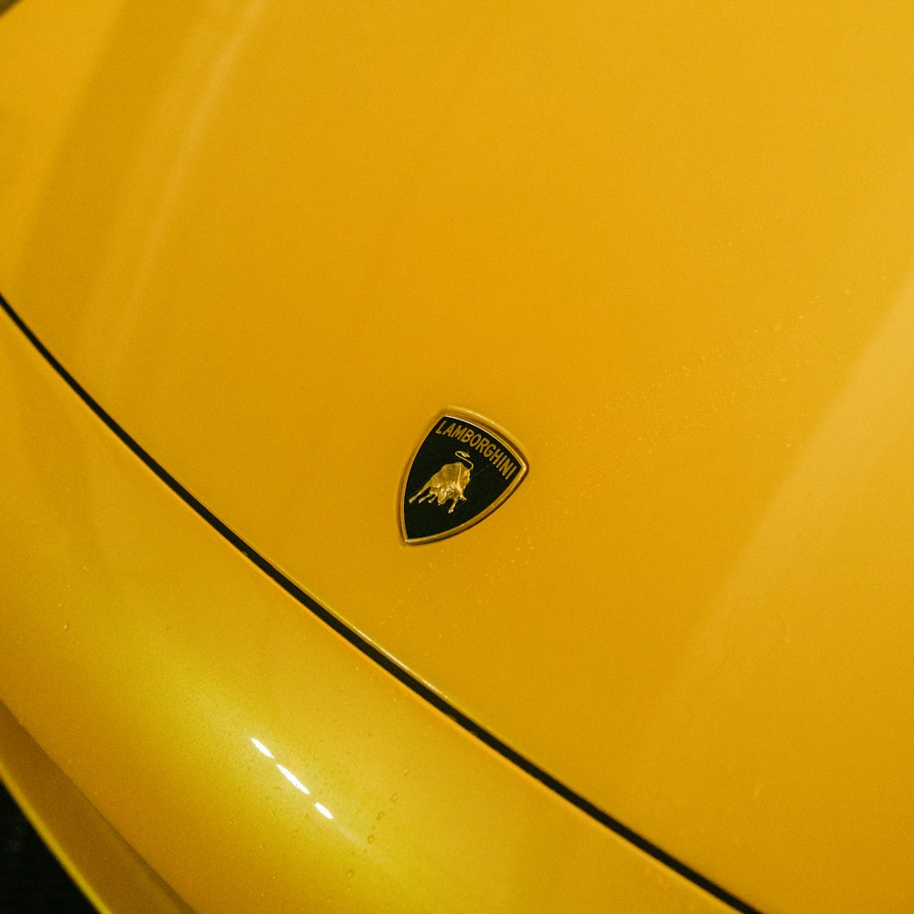 a close up of a yellow sports car