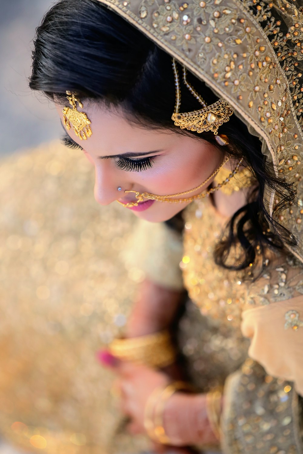 a woman in a gold and gold outfit