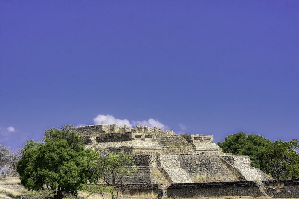 a group of pyramids sitting on top of a hill