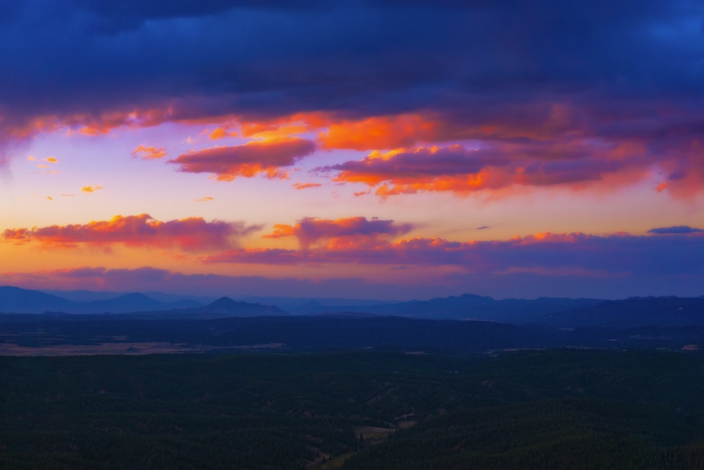 a view of a sunset over a mountain range