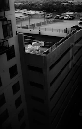 a black and white photo of a parking lot